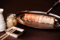 Salmon sushi on an iron tray, chef burning sushi