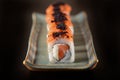 Salmon sushi roll aligned on plate Royalty Free Stock Photo