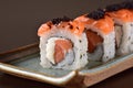 Salmon sushi roll aligned on plate Royalty Free Stock Photo