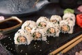 Salmon Sushi Roll In Tuna Flakes Sushi menu.