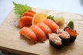 Salmon sushi and sashimi on wood plate Japanese food Royalty Free Stock Photo