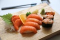 Salmon sushi and sashimi on wooden plate , Japanese food Royalty Free Stock Photo
