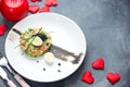 Salmon tartare with avocado black caviar and quail egg on Valentines Day , aphrodisiac food for lovers , festive delicacy