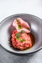 Salmon tartare with avocado and red caviar. White background. Top view Royalty Free Stock Photo