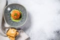 Salmon tartare with avocado, spring onion. White background. Top view. Copy space Royalty Free Stock Photo