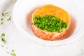 Salmon tartare with pike caviar on white plate Royalty Free Stock Photo