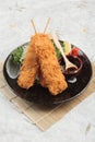 Salmon tempura sticks is deep fried salmon mixing with tempura flour served with sweet sauce. Royalty Free Stock Photo