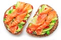 Salmon toasts with avocado isolated on white background. Top view Royalty Free Stock Photo