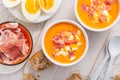 Salmorejo - raw tomato soup with ingredients on a kitchen table, spanish cuisine for hot summer