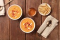 Salmorejo, Spanish cold tomato soup, overhead photo on a rustic background with wine
