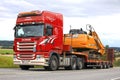 Red Scania Semi Trailer Hauls New Case Excavator