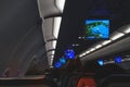 Salon of a modern airliner during a night flight. Royalty Free Stock Photo