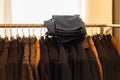 Salon shop. new coat and jeans on hangers in the boutique market Royalty Free Stock Photo