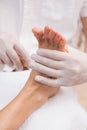 Salon worker with customers foot Royalty Free Stock Photo