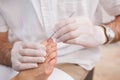 Salon worker with customers foot Royalty Free Stock Photo