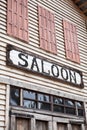 Saloon sign on western wooden building