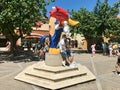 Salou, Spain, June 2019 - A statue of a person doing a trick on a skateboard