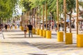 SALOU, TARRAGONA, SPAIN - SEPTEMBER 17, 2017: Yellow barrels on the waterfront of the city. Copy space for text.