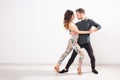 Salsa, kizomba and bachata dancers on white background with copy space. Social dance concept