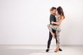 Salsa, kizomba and bachata dancers on white background with copy space. Social dance concept Royalty Free Stock Photo