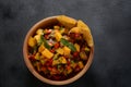 Salsa with mango, herbs, onions and peppers, corn chips close up in a bowl. Royalty Free Stock Photo