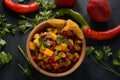 Salsa with mango, herbs, onions and peppers, corn chips close up in a bowl. Royalty Free Stock Photo