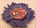 Salsa pico de gallo and blue corn tortilla chips Royalty Free Stock Photo