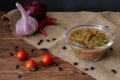 Salsa sauce, cherry tomatoes, garlic, onions and chili peppers Royalty Free Stock Photo