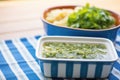 salsa verde in a square dish, blue tablecloth Royalty Free Stock Photo