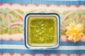 salsa verde in a square dish, blue tablecloth Royalty Free Stock Photo