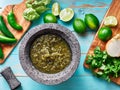 Salsa verde in stone molcajete flat lay composition Royalty Free Stock Photo