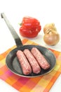 Salsiccia with vegetales in a pan Royalty Free Stock Photo