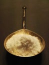 Salt in an antique spoon. Royalty Free Stock Photo