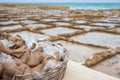 Salt Bags harvested from saltpans that is showen in the background at Marsalforn Gozo Royalty Free Stock Photo