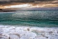 Salt beach of the Dead Sea at sunset, Jordan Royalty Free Stock Photo