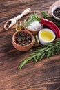 Salt, black seed pepper, branch of rosemary, red hot chili Royalty Free Stock Photo