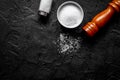 salt and saltcellar on black stone table background top view moc Royalty Free Stock Photo