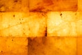 Salt bricks close up. Illuminated salt bricks in the sauna, background, texture Royalty Free Stock Photo