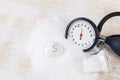 Salt consuming can increase blood pressure, pile of salt, blood pressure gauge on ecg record Royalty Free Stock Photo