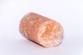 Salt crystal drill probe containing minerals causing its pink color isolated Royalty Free Stock Photo