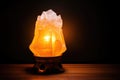 salt crystal lamp glowing in a dark room