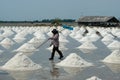 Salt farmers carry salt into the shed Royalty Free Stock Photo