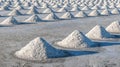 Salt farming using sunlight from the heat,Salt will be gathered together as a pile, waiting to be transported to the barn