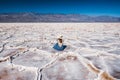 Salt Flats in Death Valley National Park. Silhouette of woman enjoying view. Badwater Basin hiking trail, trail adventure through