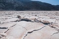 Salt flats, upheaved salt plates below sea level, and Black Mountains, Death Valley National Park, CA Royalty Free Stock Photo