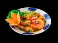 Salt fried shrimp with sauce and vegetables isolated on black backround