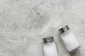 Salt in glass saltcellar on gray stone table background top view mock-up Royalty Free Stock Photo