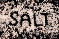 SALT inscription created from himalayan salt on black background