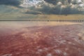 Salt lake with rose water and salt. Magnificent landscape of a salt lake on a sunny day.