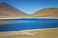 Salt lake, turquoise Laguna Miniques, volcanic landscape at sunrise, Atacama